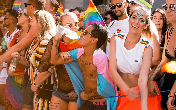 People of all races and genders joyfully celebrating LGBTQ Pride