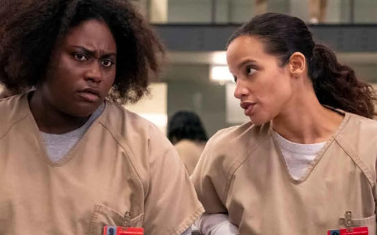 women having an intimate moment in bed