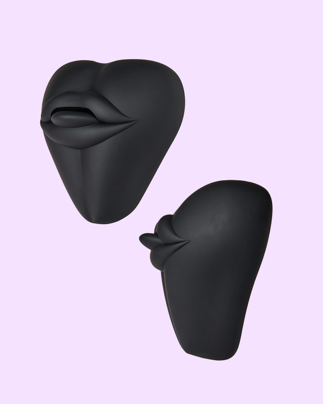 Black | Kissi dildo base cushion cover shaped like a cute mouth with tongue out three quarter and side view