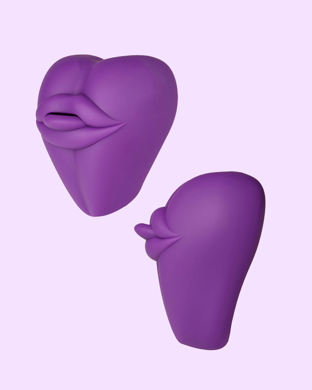 Purple | Kissi dildo base cushion cover shaped like a cute mouth with tongue out three quarter and side view